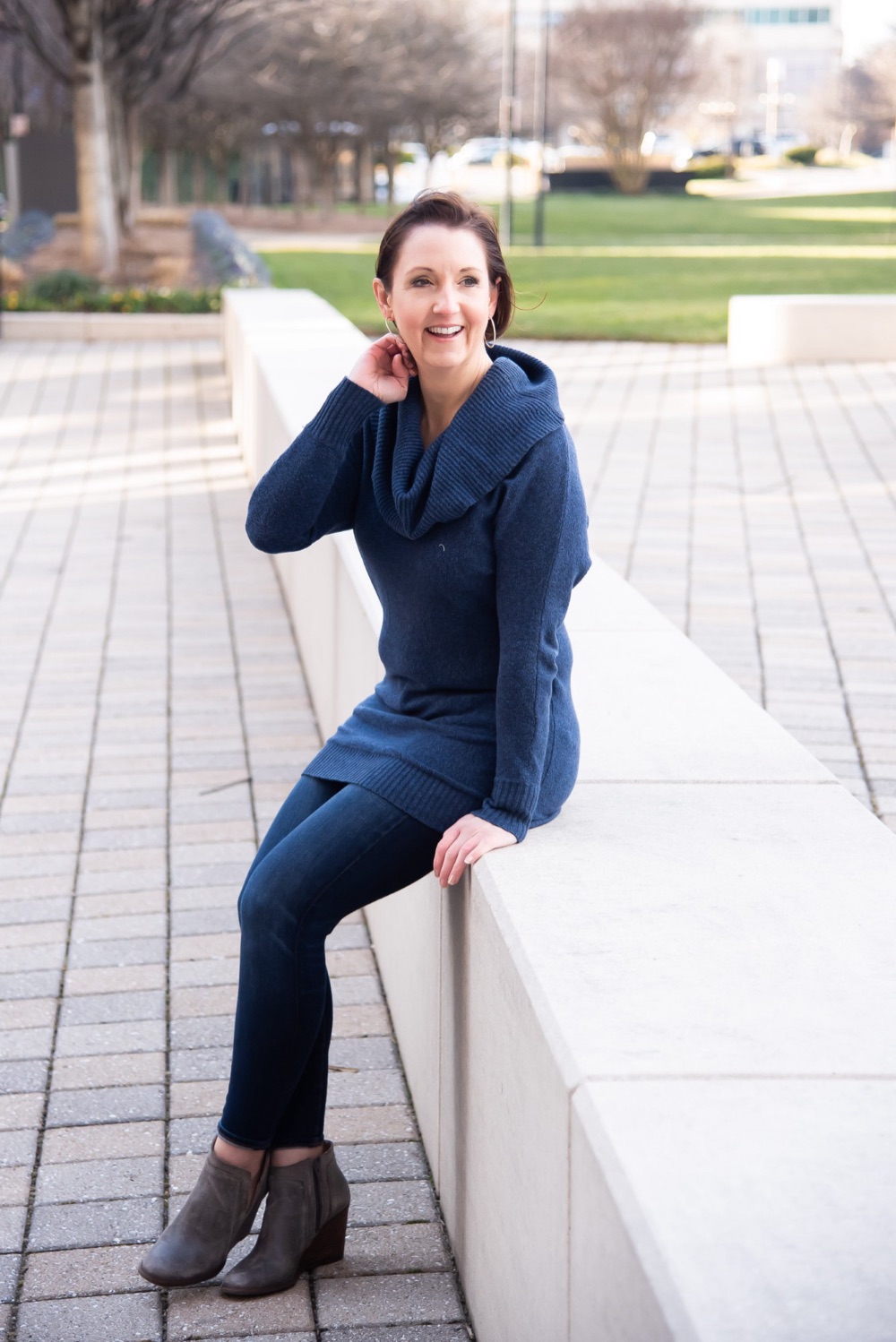 Renee Rookwood, smiling, seated outdoors